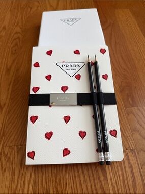 Prada set of 3 notebooks and 2 pencils.